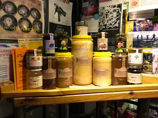A display of honey products at a market stall in Granada Albaicin.