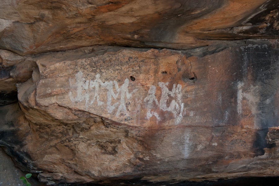 Pictographs on rock wall.